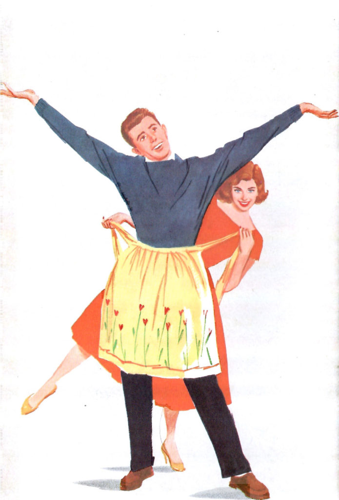 A teenage girl puts an apron on her boyfriend, insisting he can be a teen cook.