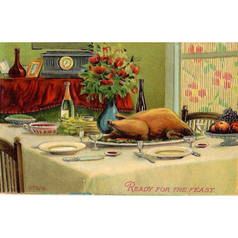 Vintage postcard of a Thanksgiving dinner table complete with turkey and all the fixings.